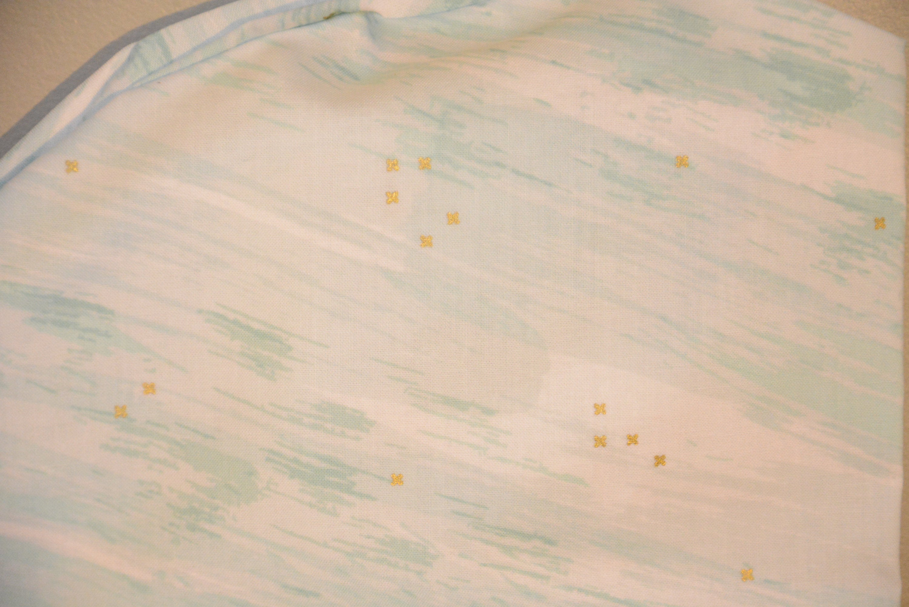 Golden Stars in Teal Clouds